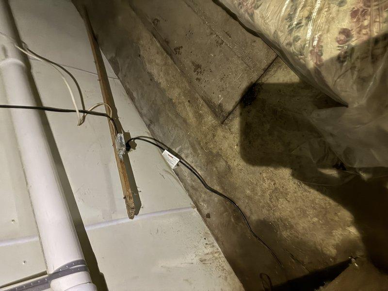 Installed dedicated electrical circuit for septic system in crawl space area. Routed new wiring along existing infrastructure, securing cables to wooden support beams and utilizing proper fastening methods throughout the run. Circuit installation completed to code specifications for septic system operation.