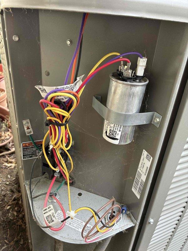 Completed MVP cooling maintenance visit on Lennox outdoor condensing unit. Performed visual inspection of electrical components including capacitor, contactor, and control board, verifying proper wire connections and component condition. Documented equipment status with interior panel and exterior unit photographs showing system in normal operating condition with no immediate service needs identified.
