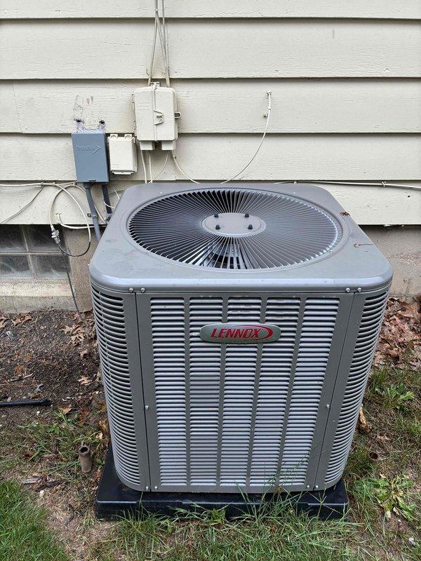 Completed MVP cooling maintenance visit on Lennox outdoor condensing unit. Performed visual inspection of electrical components including capacitor, contactor, and control board, verifying proper wire connections and component condition. Documented equipment status with interior panel and exterior unit photographs showing system in normal operating condition with no immediate service needs identified.