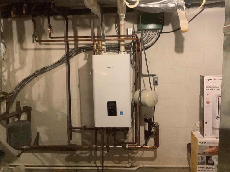 Performed comprehensive descaling service on Navien tankless water heater/boiler combo unit. Flushed system with descaling solution to remove mineral buildup and maintain optimal heat exchanger efficiency. Inspected all connections, copper piping runs, valves, and mounting hardware for proper operation and secure installation upon completion of the maintenance procedure.