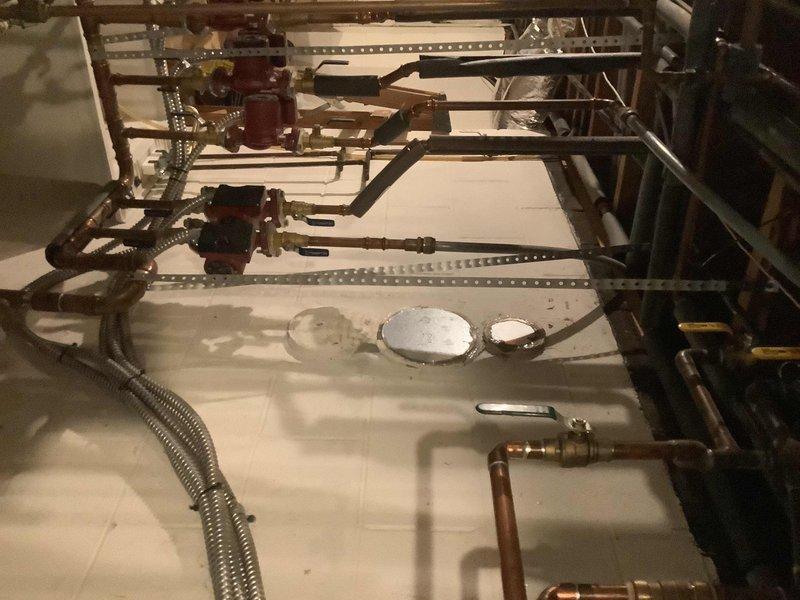 Performed comprehensive descaling service on Navien tankless water heater/boiler combo unit. Flushed system with descaling solution to remove mineral buildup and maintain optimal heat exchanger efficiency. Inspected all connections, copper piping runs, valves, and mounting hardware for proper operation and secure installation upon completion of the maintenance procedure.