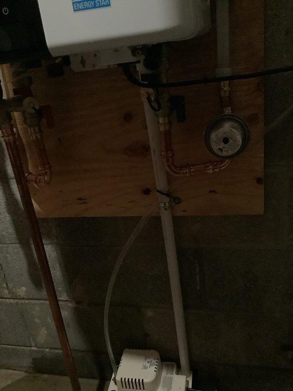 Responded to complaint of tankless water heater leaking 10-15 gallons per day. Installed new temperature and pressure relief valve along with new pressure reducing valve on the water supply system. Copper piping manifold was assembled and configured with appropriate shut-off valves and pressure monitoring equipment, mounted on plywood backing adjacent to the tankless unit. Work completed in approximately 2 hours with all necessary parts ordered and delivered to shop prior to installation.