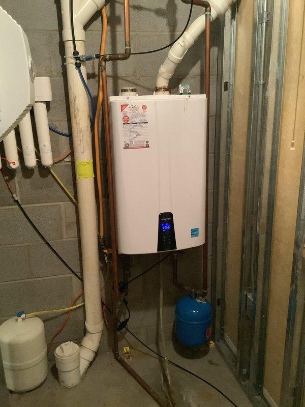 Responded to service call for 7-year-old Navien NPE180 natural gas tankless water heater experiencing inadequate temperature output despite recent flush service performed by another company one week prior. Conducted comprehensive diagnostic evaluation of the unit and associated plumbing system. Inspected all water supply lines, gas connections, copper piping, PVC venting, electrical connections, and expansion tank. Verified proper operation of water softener system and checked for any flow restrictions or scale buildup that may have been missed during previous maintenance. Tested unit performance, reviewed error codes on digital display panel, and confirmed system parameters were within manufacturer specifications. Addressed temperature regulation issue to restore proper hot water delivery to the residence.