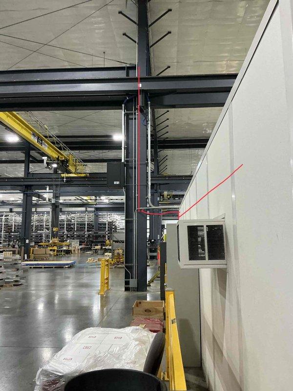 Completed estimate for mini-split installation in interior warehouse office space with modular white wall construction. Customer requested indoor placement of compressor unit in addition to standard air handler installation to accommodate facility layout and operational requirements.