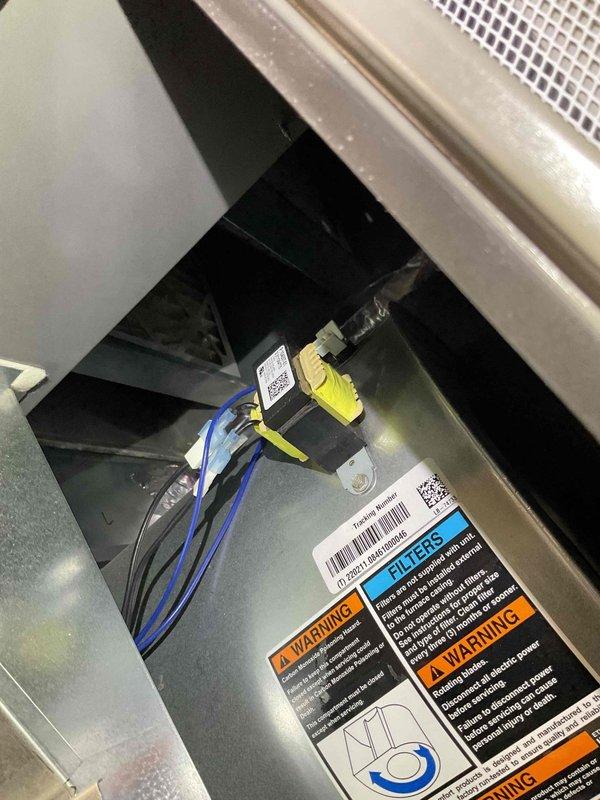 Responded to no cooling complaint on four-year-old system with reported strong cheese-like odor throughout home. Upon inspection, accessed furnace and AC unit to investigate suspected mold buildup and verify previous remediation work on condensate pan and drainage piping. Documented internal components and condition of unit, including electrical connections, control board, and ventilation assembly to assess potential microbial growth sources affecting air quality and system performance.