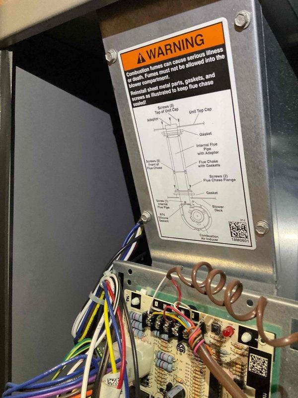 Responded to no cooling complaint on four-year-old system with reported strong cheese-like odor throughout home. Upon inspection, accessed furnace and AC unit to investigate suspected mold buildup and verify previous remediation work on condensate pan and drainage piping. Documented internal components and condition of unit, including electrical connections, control board, and ventilation assembly to assess potential microbial growth sources affecting air quality and system performance.