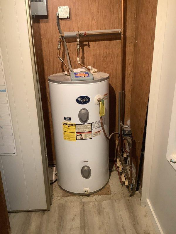 Responded to service call for 10-year-old Whirlpool natural gas tanked water heater displaying "start up failure" error on control unit. Customer reported previously replacing control board, which only functioned for one day before indicating upper element failure. Upon inspection, diagnosed faulty upper heating element and control board communication issue. Verified proper electrical connections, tested element continuity, and assessed digital control system functionality. Inspected copper supply lines, pressure relief valve, and gas connections for proper operation and safety compliance.