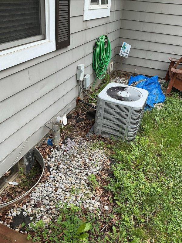 Replaced deteriorated outdoor spigot faucet on 50-year-old residential property. Accessed supply line from basement crawl space, disconnected existing copper piping with visible oxidation and age-related corrosion, and installed new frost-proof sillcock with proper grade for drainage. Verified water flow and tested for leaks at connection points and exterior mounting location near air conditioning condenser unit.