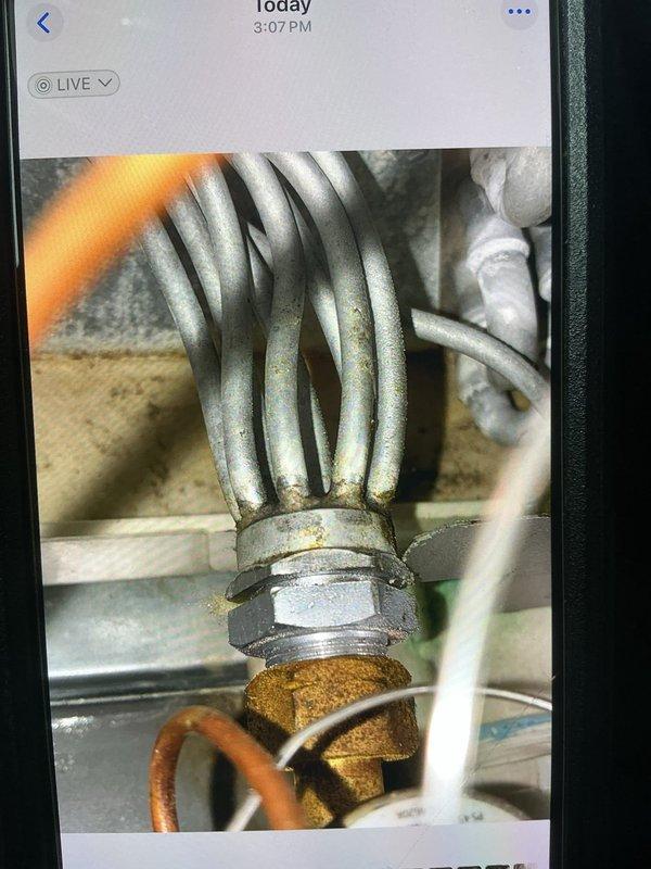 Responded to no cooling and water leak complaint on five-year-old AC system. Upon inspection, found low refrigerant charge indicated by suction line temperature and pressure readings. Located refrigerant leak at evaporator coil connection point where copper tubing joins the distribution assembly. Brazed repair completed at leaking connection, system evacuated, and recharged to manufacturer specifications. Verified proper cooling operation and condensate drainage before departure.