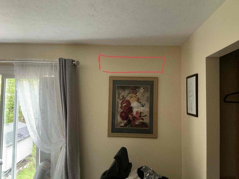 Performed site assessment for new mini split air conditioning system installation in second floor room with no existing equipment. Evaluated interior wall space and identified optimal mounting location for indoor air handler unit above window area. Inspected existing electrical panel to verify adequate circuit capacity and available breaker positions for dedicated mini split circuit connection. Documented installation requirements and captured measurements for equipment placement and line set routing.