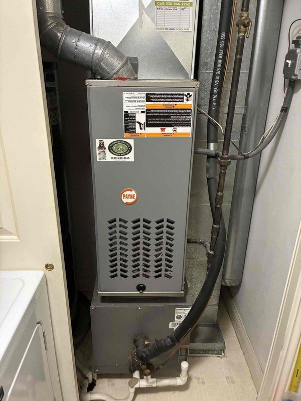 Completed comprehensive AC tune-up on 8-year-old residential cooling system and Payne furnace installation. Performed standard maintenance protocol including inspection of outdoor condenser unit, verification of proper airflow through protective mesh screening and fan assembly, and assessment of indoor air handler components. All equipment operating within normal parameters with no deficiencies noted.