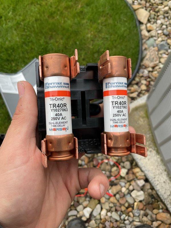 Completed scheduled air conditioning maintenance on residential cooling system. Performed comprehensive inspection of condenser unit, including examination of internal components, coil condition, and electrical connections. Installed surge protection device with dual-element time-delay fuses rated at 40A 250V AC (Ferraz Shawmut Tri-Onic TR40R) to protect equipment from electrical surges and power fluctuations. System operating within normal parameters upon completion.