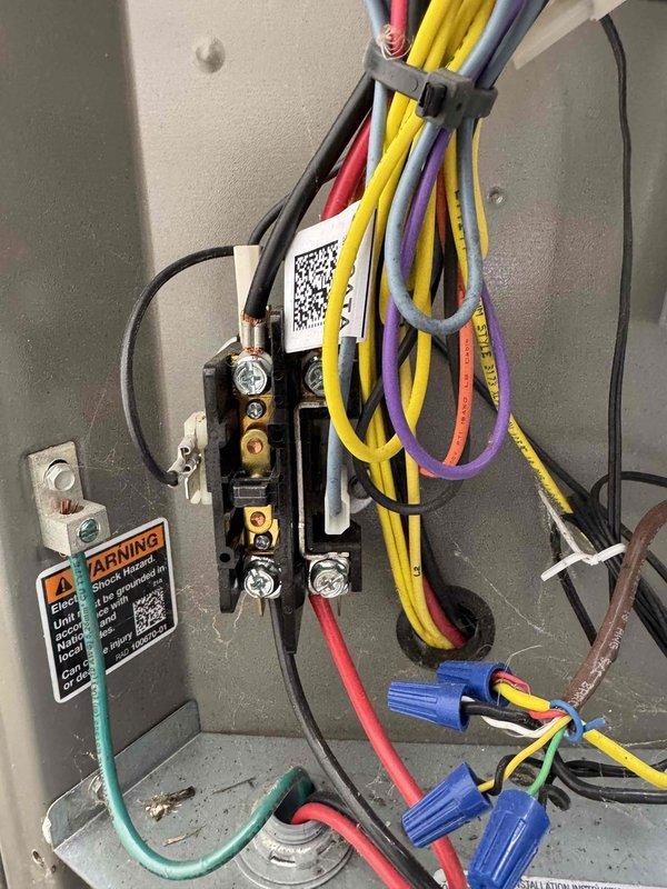 Completed comprehensive AC tune-up including system diagnostics and electrical verification. Measured compressor amperage at 6.63A using digital multimeter, confirming unit operating within manufacturer specifications. Inspected control panel wiring connections, verified all terminal blocks secure, and confirmed proper wire routing and grounding connections intact.
