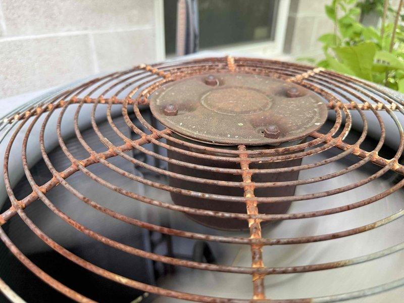 Completed routine cooling maintenance on outdoor HVAC unit. System inspected and confirmed operational, with all components functioning within normal parameters. Unit shows significant exterior weathering and rust on fan grille, consistent with extended outdoor exposure, but mechanical operation remains unaffected.
