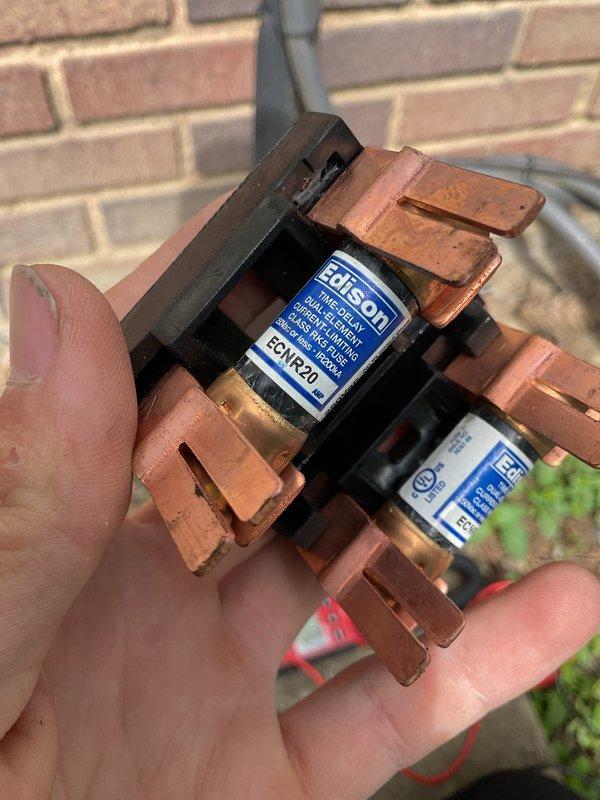Completed scheduled preventive maintenance on 10-year-old residential air conditioning system. Performed comprehensive inspection including electrical components, refrigerant levels, and ductwork integrity. Inspected outdoor disconnect fuse assembly, noting weathered copper connections with oxidation present on fuse holders; fuses tested within acceptable parameters. Measured supply air temperature at 46.9°F, confirming proper cooling operation and adequate refrigerant charge. Examined ductwork insulation for integrity and proper sealing. System operating efficiently with no immediate repairs required. Recommended monitoring fuse assembly connections for future replacement consideration due to oxidation buildup.
