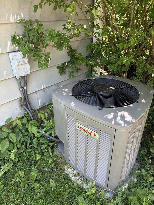 Completed preventative maintenance on aging Lennox air conditioning system. Performed standard tune-up procedures including temperature diagnostics, recording supply air temperature of 71.2°F, and comprehensive system evaluation. Noted excessive vegetation growth around outdoor condenser unit requiring customer attention to maintain proper airflow and equipment longevity.