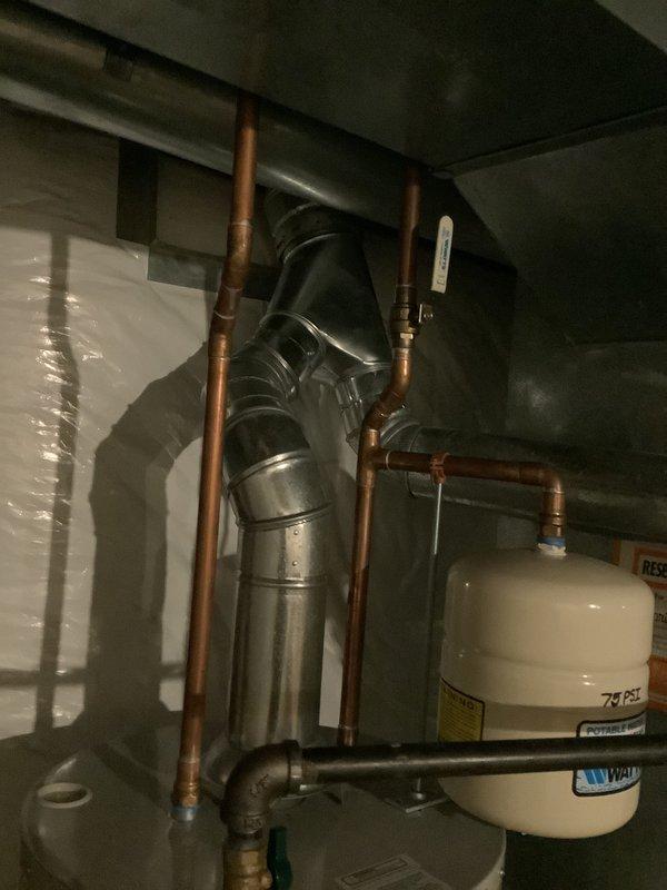Conducted comprehensive assessment of existing HVAC system including Bryant furnace and air conditioning unit with frozen evaporator coil. Evaluated aged equipment condition, documented current mechanical room configuration with ductwork, water heater proximity, and electrical panel placement. Provided estimate for complete HVAC system replacement including both furnace and air conditioning components due to equipment age and operational failure.