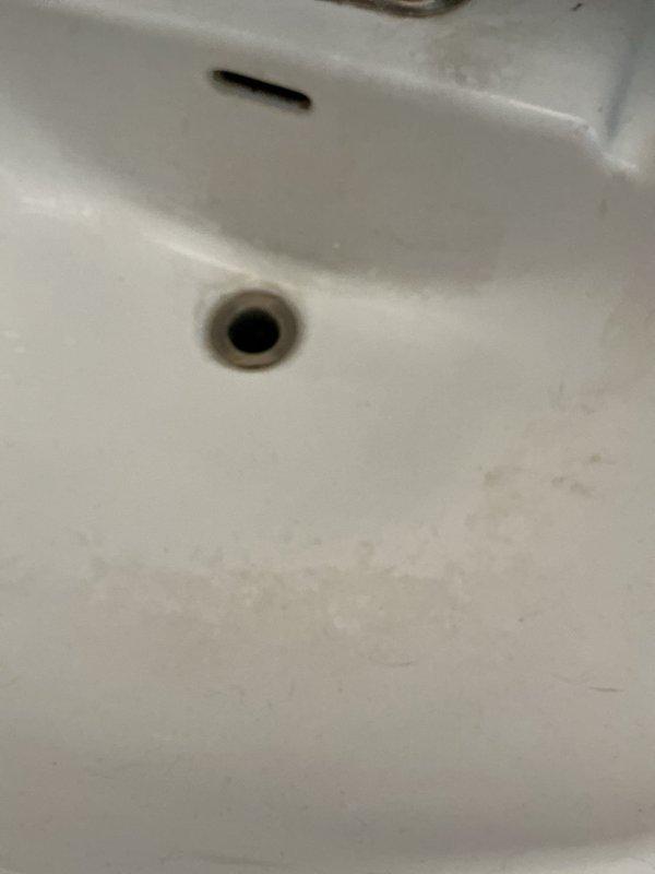 Responded to upstairs bathroom sink clog. Upon arrival, assessed the drainage system and identified blockage in the sink drain line. Utilized plunger and mechanical snaking equipment to clear the obstruction, restoring proper water flow and drainage function. Tested sink operation to confirm complete resolution, with water draining freely without backup. Photographed work area and plumbing connections for documentation purposes.
