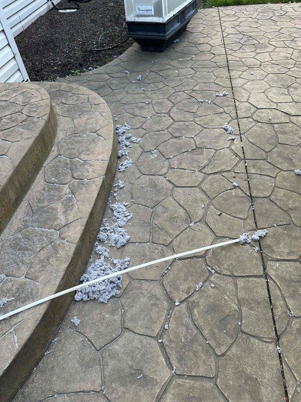 Completed dryer vent cleaning service with heavily accumulated lint and dust buildup throughout the duct system. Removed significant debris from interior vent surfaces and thoroughly cleaned the exhaust pathway from the dryer to the exterior termination point. Documentation photos captured the extent of the initial buildup and the cleaning process, with exterior work performed on the patio area where the vent terminates.