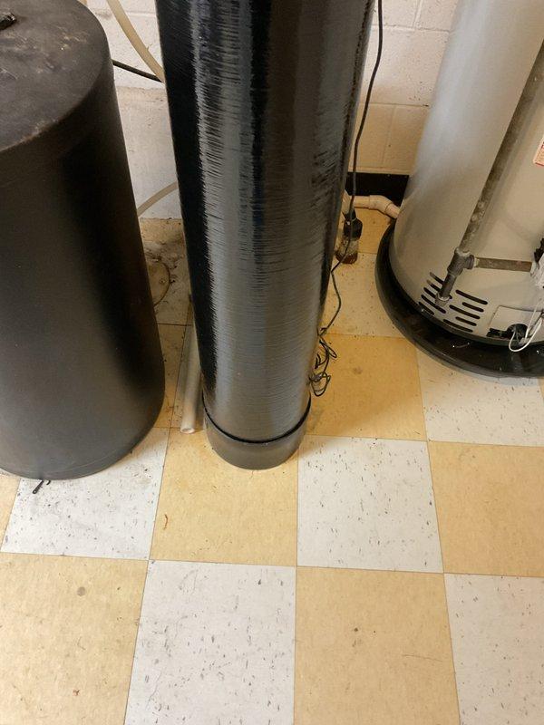 Installed a new 50-gallon Bradford White tanked water heater in basement utility area, replacing existing unit. Completed all necessary code upgrades including proper copper piping connections, expansion tank installation, and appropriate venting system integration. All plumbing connections were secured to manufacturer specifications and system was tested for proper operation upon completion.
