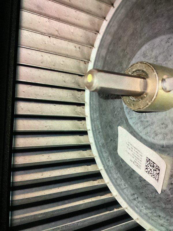 Completed preventive maintenance cooling visit on 8-year-old Lennox air conditioning system. Inspected outdoor condenser unit, verified proper operation of blower motor and squirrel cage fan assembly, and documented equipment condition with photos showing normal operational wear and dust accumulation on interior components.