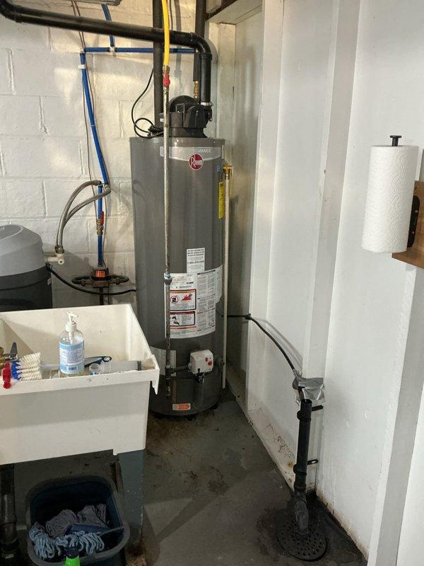 Responded to main drain backup with slow drainage issue. Upon arrival, located main drain cleanout access point in basement utility area near water heater. Performed thorough inspection of drainage system and cleanout assembly. Successfully cleared main drain line obstruction using professional drain cleaning equipment. Verified proper flow and drainage restored to system. Tested multiple fixtures to confirm blockage eliminated and drainage operating at normal capacity.