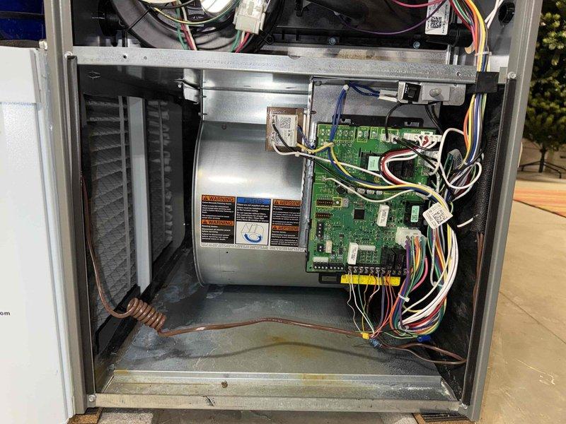 Completed MVP recurring maintenance visit on 14-year-old cooling system. Performed thorough inspection of unit with access panel removed, examining evaporator coil, refrigerant lines, electrical connections, and control board components. Documented system condition including circuit board integrity, wiring connections, and overall operational status of all mechanical and electrical components.