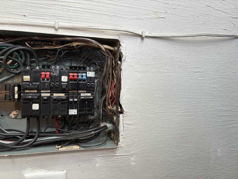 Completed electrical panel update at residential property. Serviced exterior-mounted panel installation with multiple circuit breakers and distribution components. Addressed wiring concerns and panel configuration. Customer also consulted regarding mini split installation options for future HVAC upgrade.