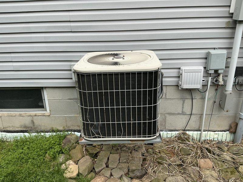 Conducted on-site evaluation of 24-year-old residential air conditioning system for replacement estimate. Assessed existing outdoor condenser unit, refrigerant line set configuration, electrical disconnect, and installation conditions. Documented equipment specifications, mounting pad condition, and clearance requirements for proposed replacement system.