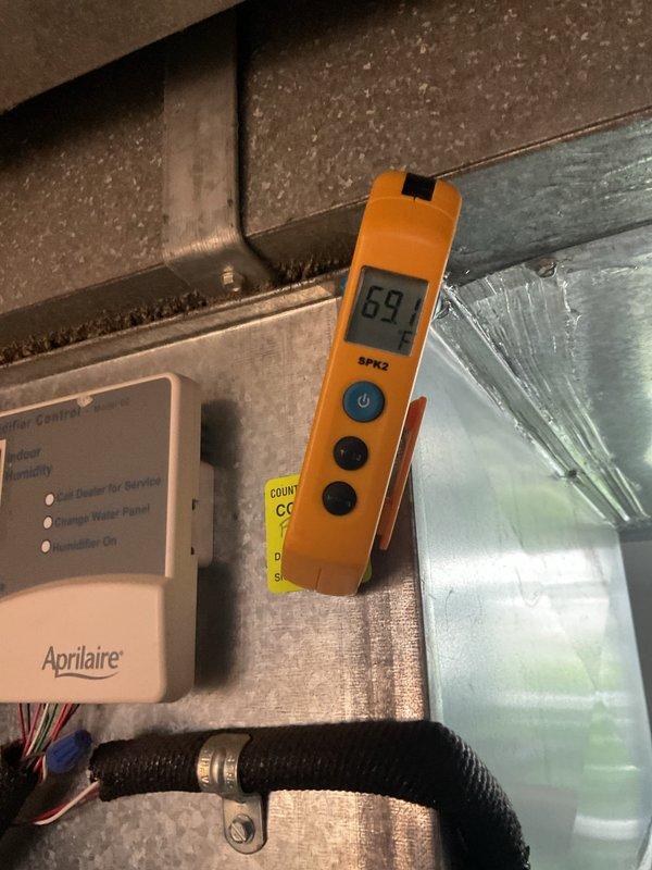 Completed preventive maintenance on 8-year-old residential cooling system for MVP customer. Performed comprehensive system inspection including evaporator coil assessment, electrical component testing, and airflow verification in attic installation. Measured system performance parameters using digital testing equipment, recording temperature readings of 69°F at Aprilaire humidifier control location. All components including heat exchanger, control box, and ductwork found to be in proper working condition with no immediate service needs identified.