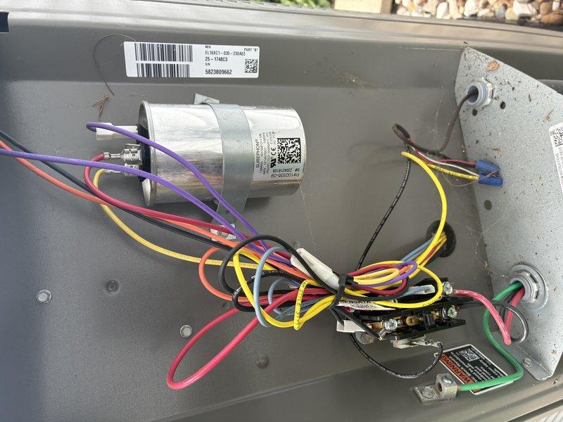 Completed preventive maintenance on 2-year-old air conditioning system. Performed electrical diagnostics using digital multimeter, verifying voltage readings and system performance at 27.5V on measured circuit. Inspected all electrical components within control panel including capacitor, wiring connections, and terminal blocks. All connections found secure with proper color-coded wiring intact. System operating within normal parameters with no deficiencies noted.