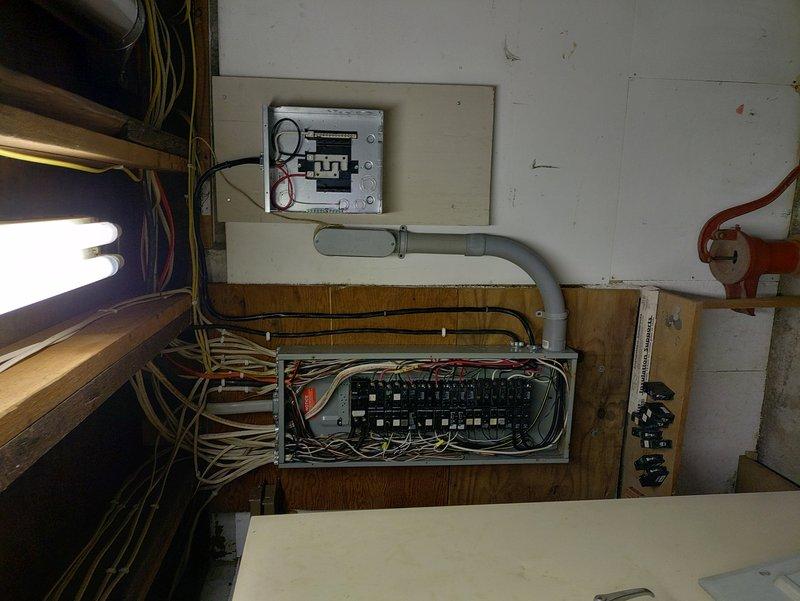Installed sub panel in utility room with proper conduit runs and wire management to electrical code specifications. Added dedicated AC circuit with appropriate breaker sizing and wire gauge, utilizing truck stock materials. All connections tested and verified operational upon completion.
