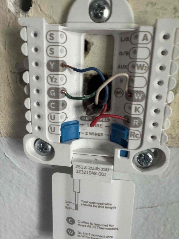 Responded to no cooling call on 4-year-old air conditioning system. Upon arrival, verified unit was not powering on. Inspected thermostat wiring connections and control board assembly. Found issue with low voltage wiring at thermostat terminal block affecting system communication. Corrected wiring connections at thermostat base, ensuring proper C-wire and W-wire terminations per manufacturer specifications. Verified all wire connections at control board terminal strip were secure. Cycled system power and confirmed unit now responding to thermostat calls properly. System operational at time of departure.