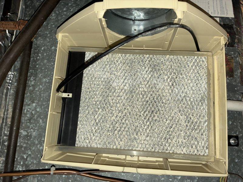 Completed preventive maintenance on 9-year-old residential air conditioning system. Inspected and verified blower wheel assembly showing clean condition with no debris accumulation or excessive wear on squirrel cage fan blades. Examined air handler unit in attic installation, confirmed air filter in place with proper fitment, and verified all accessible components operating within normal parameters.