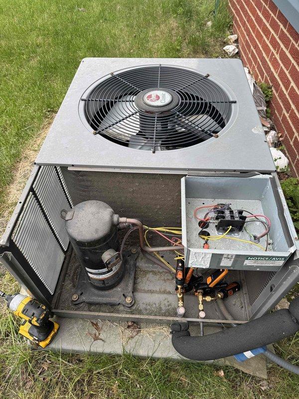 Responded to no-cooling call for central air conditioning unit that failed to operate during first use of the season. Upon arrival, removed top panel and performed diagnostic testing of outdoor condensing unit components. Used digital multimeter to test electrical connections, capacitor, and compressor functionality. Identified failed component preventing unit operation, completed necessary repairs to restore system functionality, and verified proper operation of compressor, condenser fan, and electrical controls before closing unit and returning system to service.