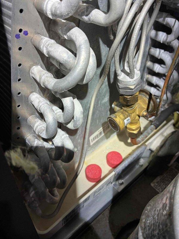Completed comprehensive A/C tune-up service including full system inspection and maintenance. Installed customer-provided filter into humidifier system and provided complimentary carbon monoxide detector. Inspected evaporator coil assembly, refrigerant lines, and all system components; all equipment found to be in operational condition with normal wear patterns consistent with regular use.