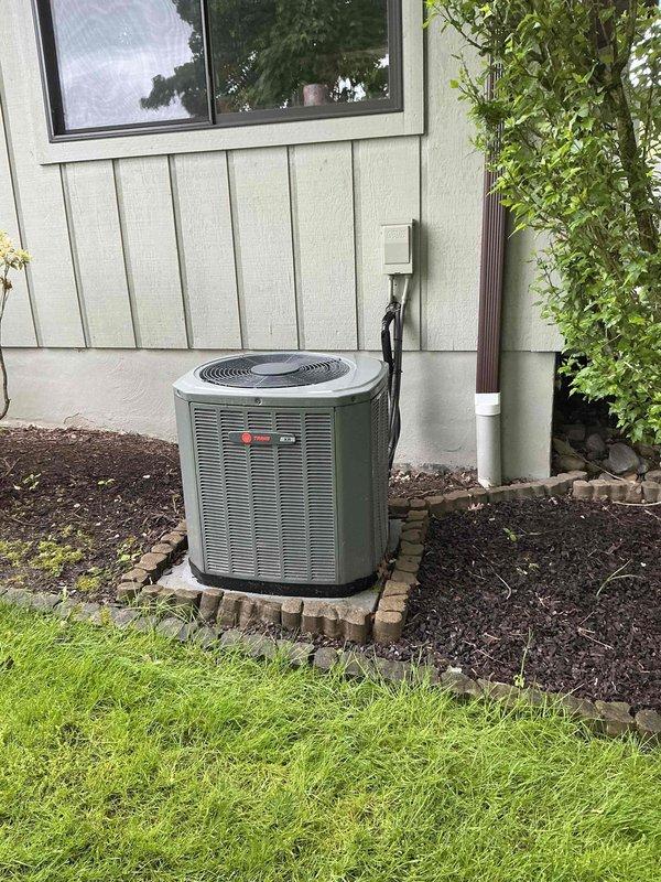 Completed HVAC system replacement estimate for residential property. Assessed existing Trane furnace unit located in basement mechanical room and outdoor air conditioning condenser with cylindrical design positioned on concrete pad with brick paver border. Evaluated current system configuration including gas line connections, refrigerant line set, electrical disconnect, and ductwork routing to provide comprehensive replacement quote for complete heating and cooling system upgrade.
