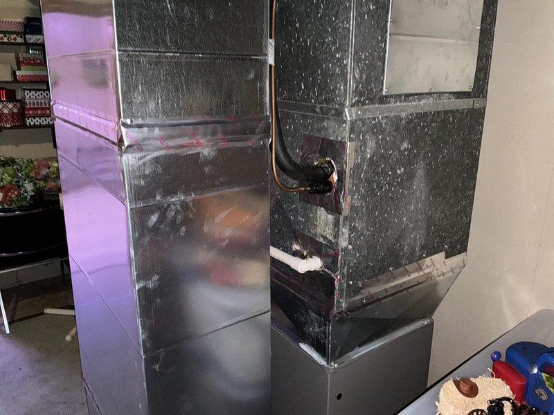Conducted on-site assessment for HVAC system replacement in commercial retail environment. Evaluated existing air handler unit with vertical configuration and assessed basement utility area including water heater and drainage systems to provide comprehensive equipment replacement estimate.