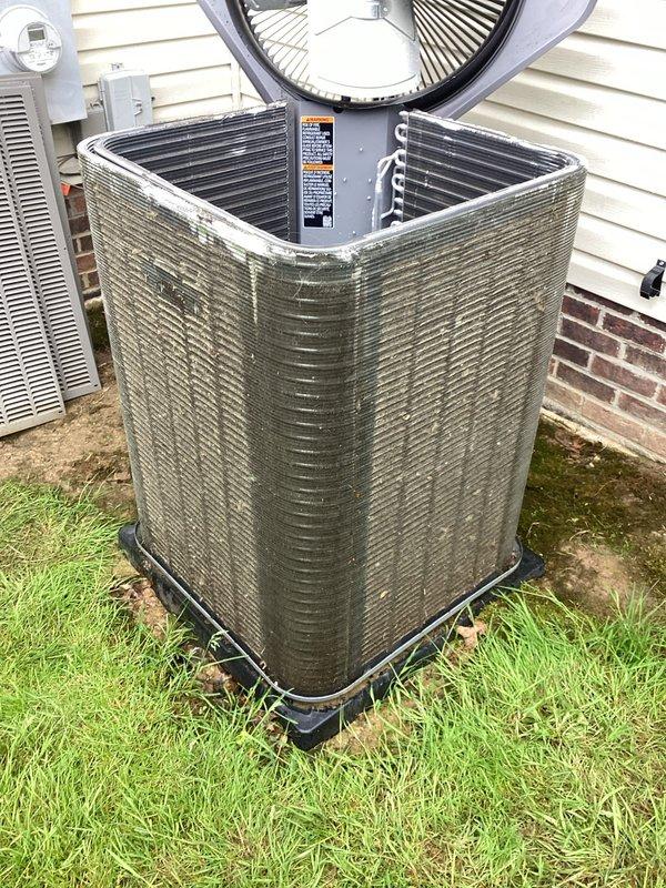 Completed scheduled preventive maintenance on 9-year-old residential cooling system. Performed comprehensive inspection of outdoor condensing unit, including examination of condenser coils, fan operation, and cabinet condition. Unit showed significant accumulation of dust and debris on exterior grille surfaces, which was documented. Verified proper refrigerant line connections and assessed overall system functionality. All components operating within normal parameters at time of service.