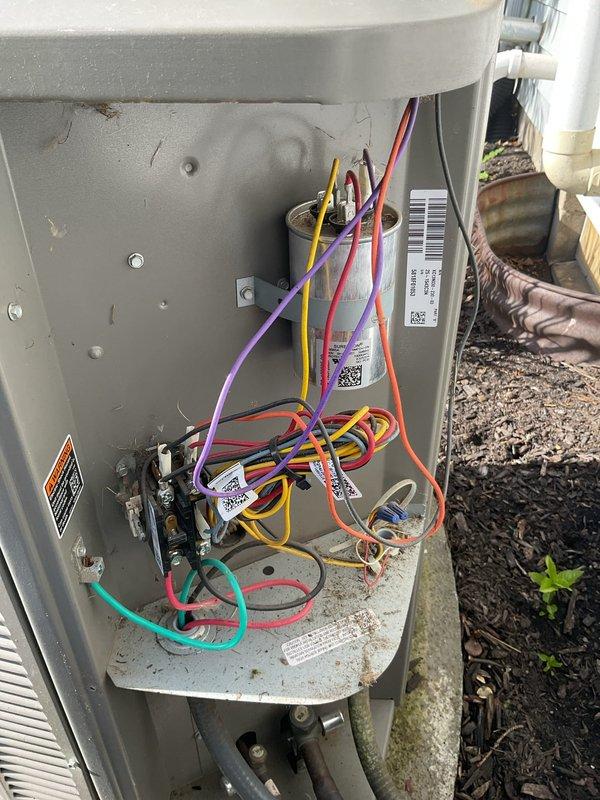 Completed comprehensive spring tune-up on eight-year-old air conditioning system, including full inspection of electrical components, capacitor testing (40+5 MFD dual run capacitor verified within tolerance), and verification of all wire connections at contactor and terminal blocks. Unit was found in good operating condition with all electrical components functioning properly and system ready for cooling season.