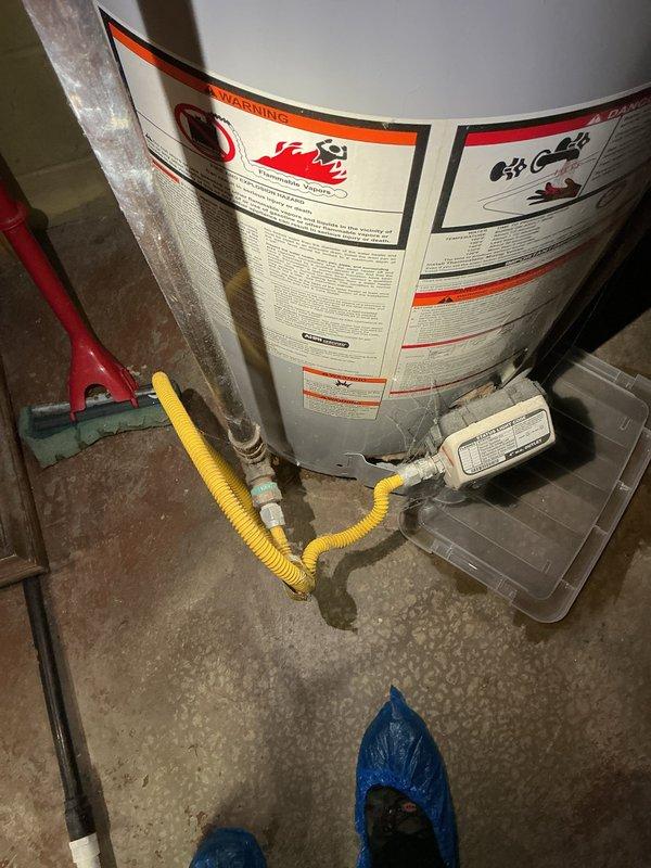 Completed water heater replacement in a 1947-built residence. Removed existing aging water heater unit and installed new replacement tank with proper venting and safety compliance. Connected gas supply line using flexible yellow corrugated tubing with appropriate shutoff valve and fittings. Installed copper water supply lines with brass compression fittings, ensuring secure connections for both hot and cold water distribution. Verified all plumbing connections for leaks, confirmed proper gas line installation, and tested unit operation. All work performed meets current plumbing codes and manufacturer specifications for safe water heater operation.