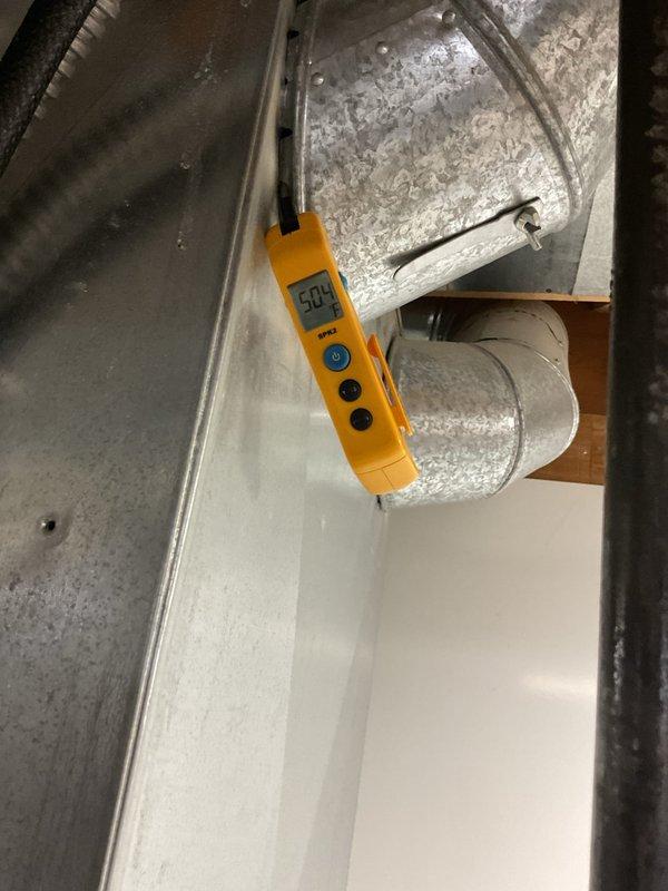 Completed scheduled air conditioning maintenance visit. Performed comprehensive system inspection including visual examination of mechanical components, condensate drainage system, and ductwork. Measured and recorded system operating parameters using digital testing equipment, with supply air temperature reading at 50°F indicating proper cooling performance. All components found operating within normal specifications.