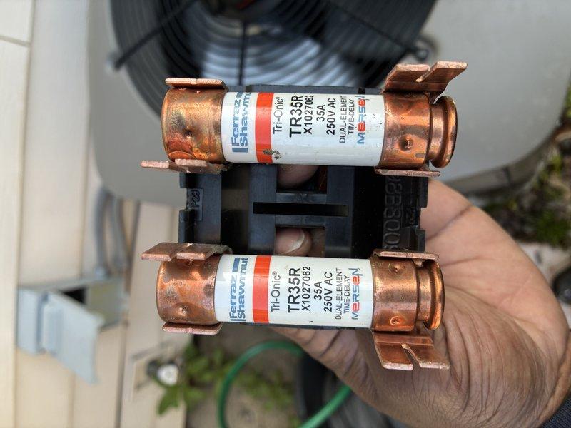 Completed routine MVP cooling maintenance visit on residential HVAC system. Inspected outdoor condenser unit, verified operational status, and replaced two TR35R time-delay fuses (250V AC) in the electrical disconnect to ensure proper system protection and reliable operation.