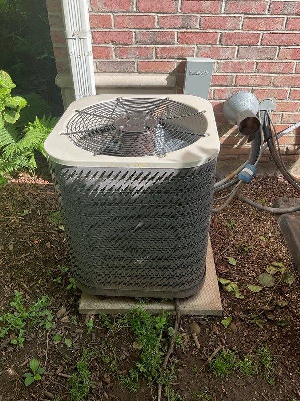 Responded to no cooling complaint on residential air conditioning system aged 15-20 years. Upon arrival, performed diagnostic evaluation of outdoor condensing unit. Connected manifold gauge set to service ports to measure system pressures and assess refrigerant charge. Conducted visual inspection of condenser unit exterior, electrical connections, and refrigerant line set. Unit showed signs of age-related wear with weathering on exterior panels and some corrosion present at service connection points. System evaluation completed to determine operational status and identify potential causes of inadequate cooling performance.