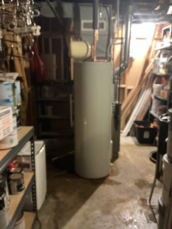 Completed installation of 50-gallon electric water heater in basement mechanical room. Parts were ordered and received in shop, followed by system installation with new water heater kit including all necessary connections to existing copper piping, pressure tank, and expansion tank. All plumbing connections were secured, system was tested for proper operation, and installation was documented with photos showing completed configuration with pressure management equipment and HVAC integration.