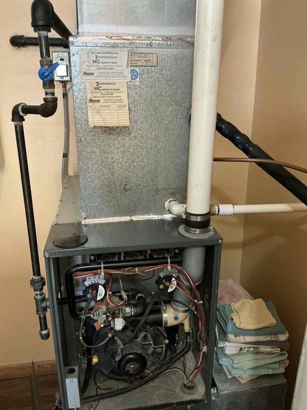 Conducted comprehensive on-site evaluation for complete HVAC system replacement involving existing furnace and air conditioning equipment. Documented current system configuration including vertical air handler installation, gas supply connections with shutoff valves, condensate drainage piping, and electrical components. Assessed ductwork integration, filter accessibility, and overall system condition to provide accurate replacement specifications and equipment recommendations.