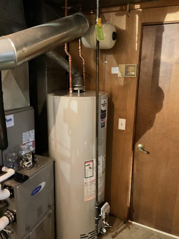 Successfully completed a comprehensive plumbing system upgrade involving the replacement of three major components in the residential mechanical room. Removed and replaced the existing 50-gallon gas-fired water heater with a new unit, including proper venting connections and gas line hookup. Installed a new Well-Rite pressure tank to replace the failing well tank system, ensuring proper pressure regulation for the home's water supply. Replaced the water softener system with updated equipment, connecting all necessary inlet and outlet plumbing lines with copper piping and appropriate valves. All installations were completed with proper code-compliant connections, pressure relief valves, and shut-off valves for future maintenance access. System was tested for leaks, proper pressure, and operational functionality upon completion.