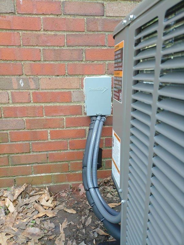 Completed full HVAC system replacement including installation of Lennox two-stage condenser unit (Model CX40CT-24A-71) on composite pad with new refrigerant lines and two-stage variable speed furnace. Installed DiversiTech electrical disconnect box with weatherproof conduit connection to outdoor unit, connected old laundry chute to existing return trunk line for improved air circulation, and integrated WiFi-enabled thermostat with second floor remote sensor and media filtration system for enhanced indoor air quality and zoned temperature control.