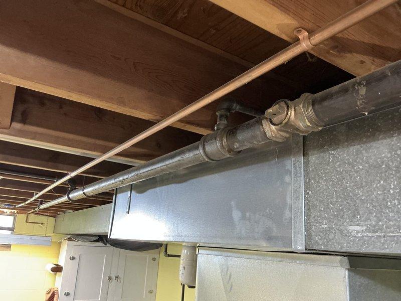 Completed electrical estimate for standby generator installation in residential basement utility area. Evaluated existing electrical infrastructure, including main service panel location, available conduit pathways, and necessary transfer switch placement. Assessed structural requirements for generator pad installation, fuel line routing options, and compliance with local electrical codes. Documented existing HVAC ductwork, plumbing lines, and utility configurations to determine optimal generator placement and minimize interference with current building systems. Photographed basement mechanical room conditions, wall construction, and available space for equipment installation to provide accurate material and labor calculations for proposed automatic transfer switch and generator system.