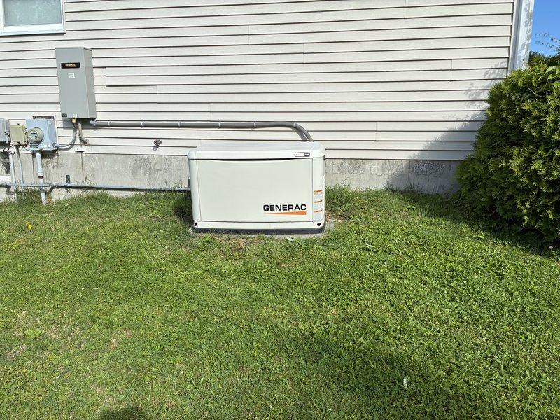 Performed scheduled maintenance on a Generac 20kW standby generator unit. Conducted comprehensive inspection of engine components, electrical connections, and control systems with access panel fully opened for thorough examination. Verified proper operation of cooling systems, fuel lines, and internal wiring. Inspected exterior conduit connections to main electrical panel and transfer switch equipment. Completed routine maintenance procedures including fluid level checks and system diagnostics to ensure reliable backup power operation.